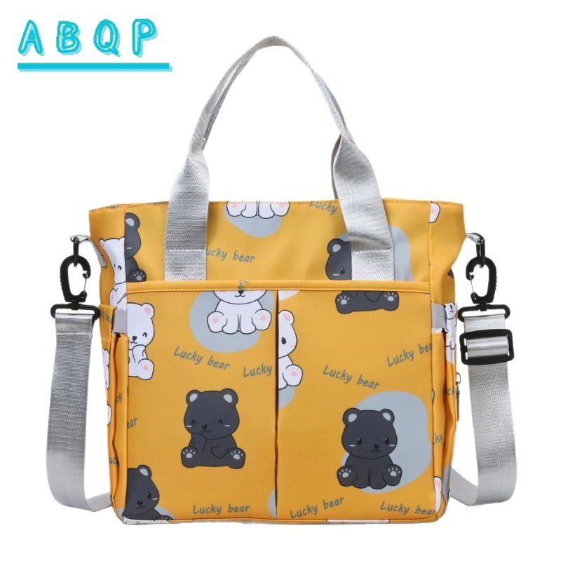Baby Products Brand - ABQP 新しいおむつバッグハンドバッグ高級ブランド漫画ベビーおむつショルダーバッグ大容量ファッショナブルなベビー用品収納バッグ